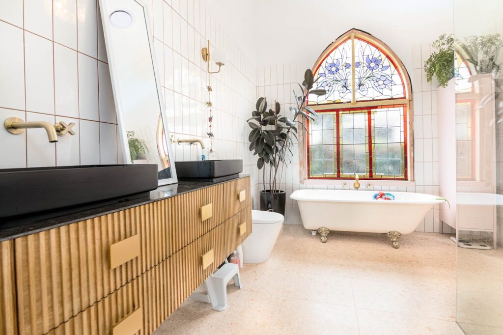 Luxurious bathroom in Melbourne featuring stained glass windows and modern decor.